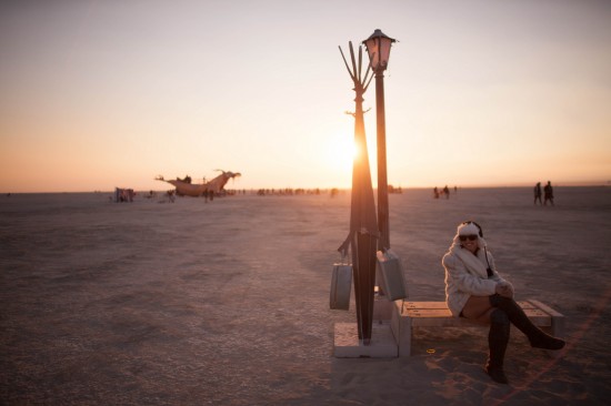 Women's Burning Man cold weather clothing at sunrise on the playa