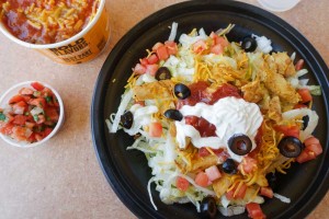 Taco John's taco salad with a side of refried beans