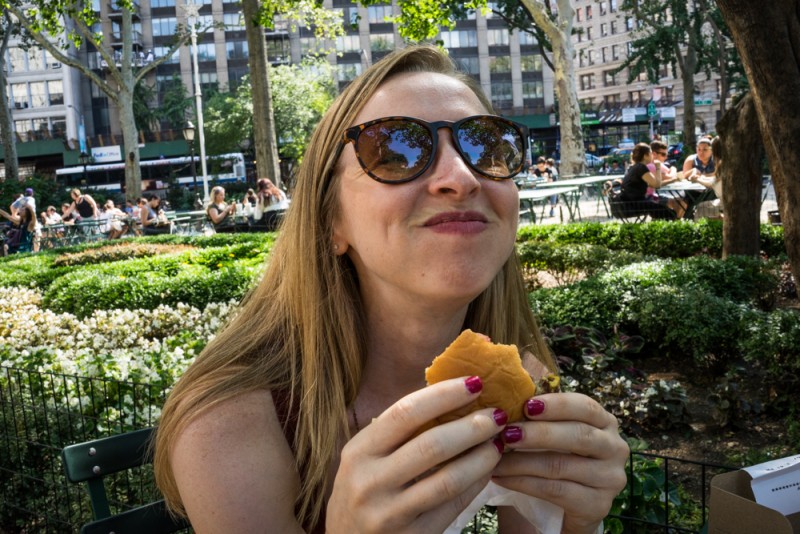 enjoying a Shake Shack burger in New York City
