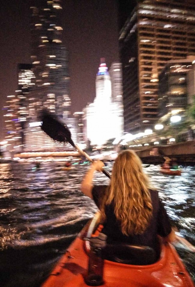 kayaking at night in downtown Chicago on the Chicago River