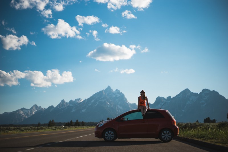 Sitting on the car in Grand Teton National Park