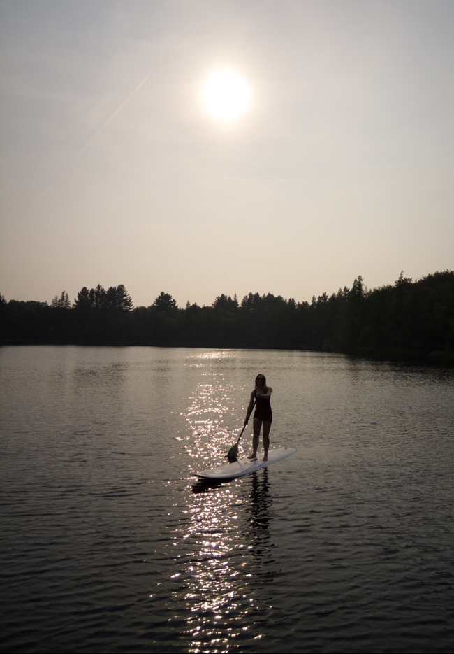 paddleboarding on a lake in the Adirondacks