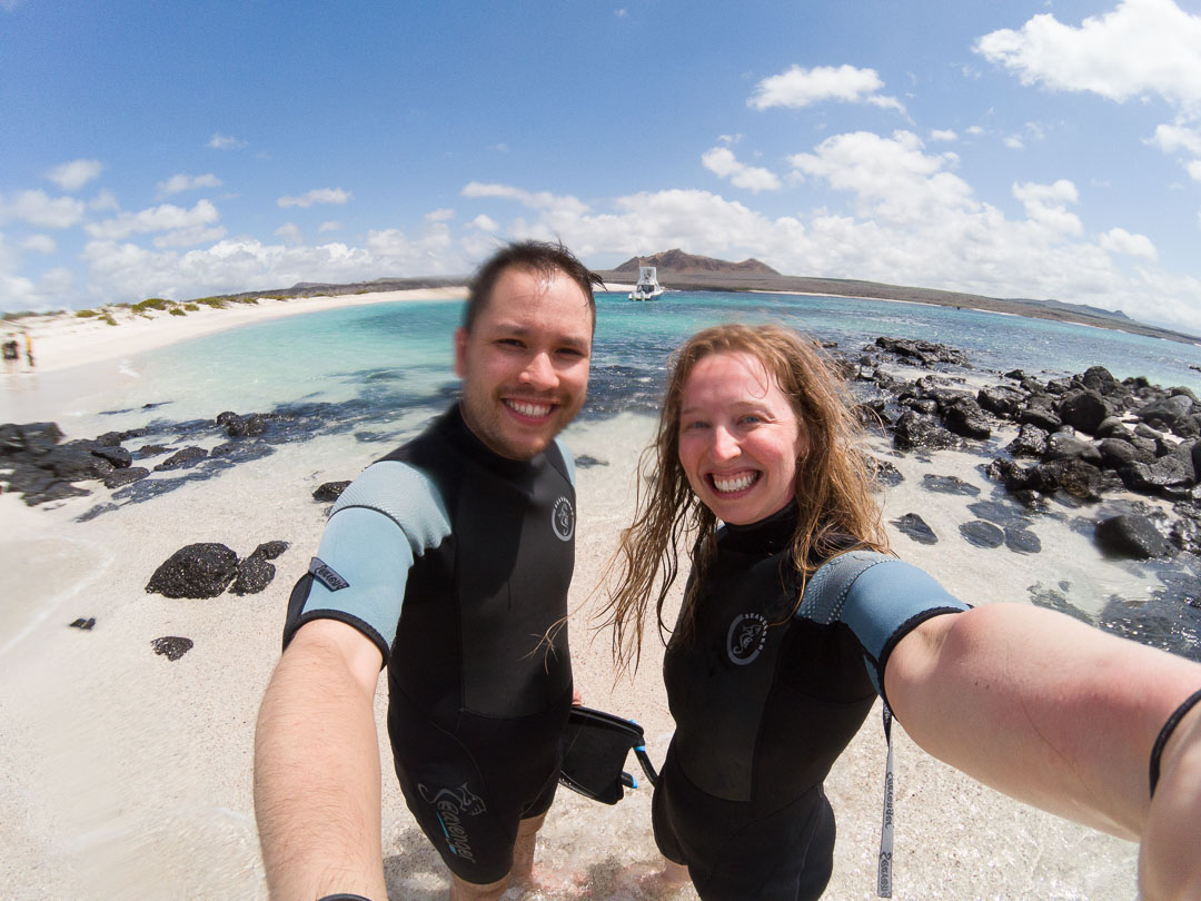Our smiles, just after snorkeling at Bahía Rosa Blanca on San Cristobal Island.